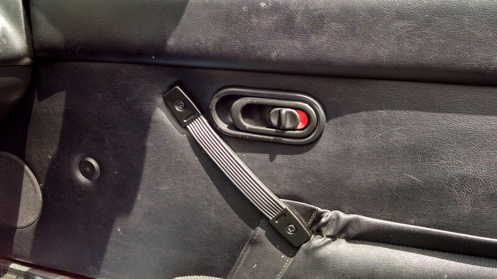 Miata door handle replaced with Parts-Express Penn-Elcom strap handle