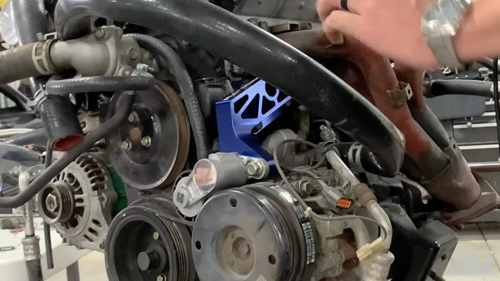 Teaser of FM's new power steering delete auto-tensioning belt idler