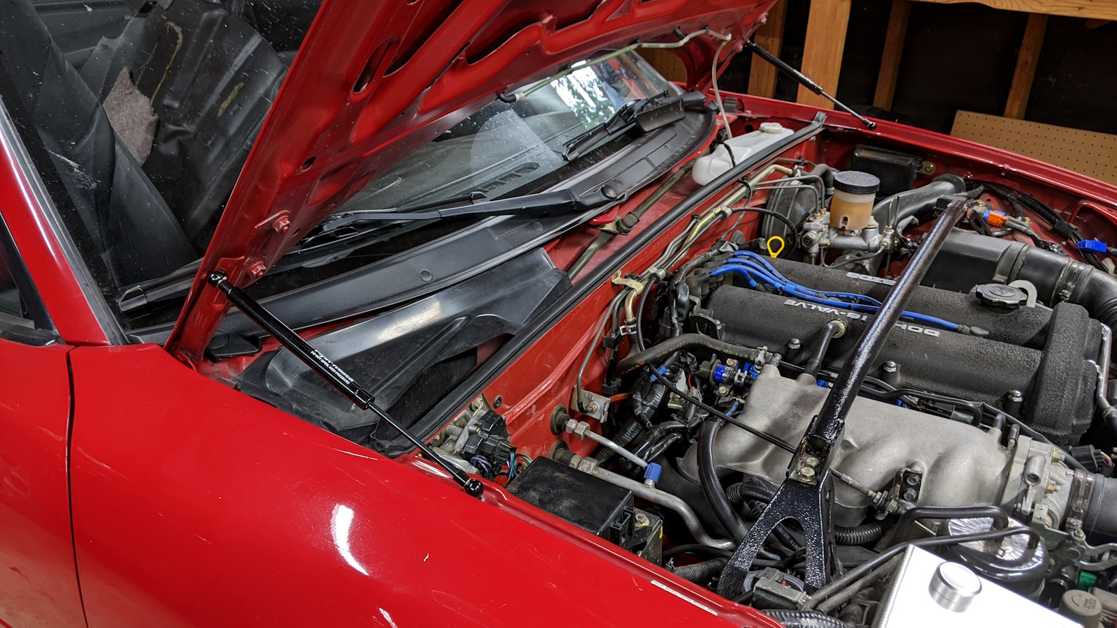 Both hood struts installed