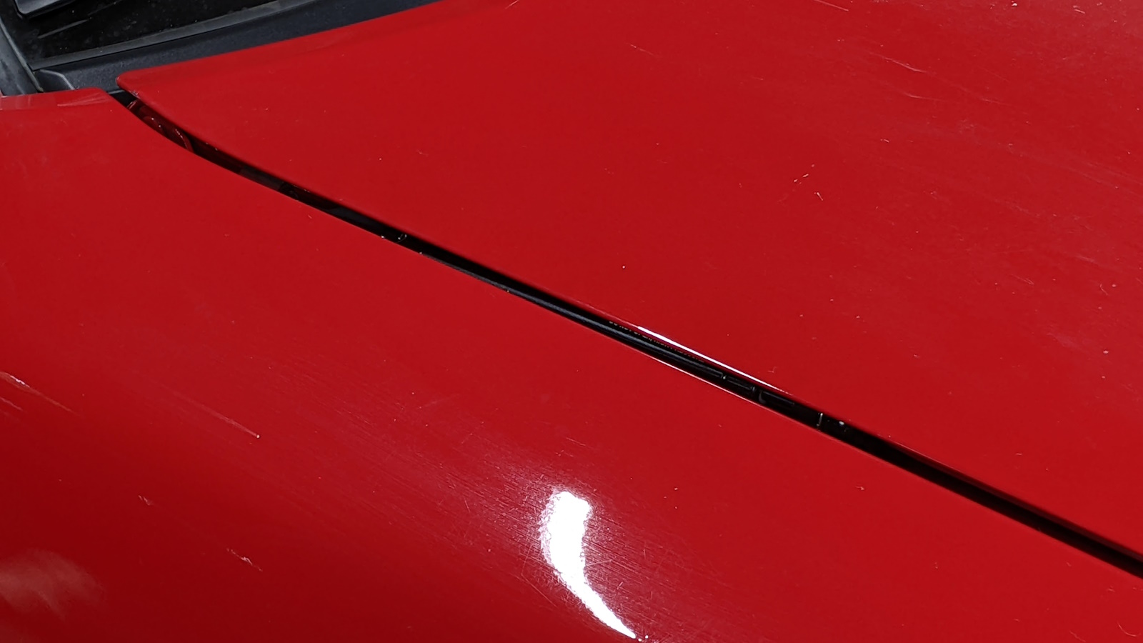Just the hint of the gas strut visible through the panel gap when the hood is closed